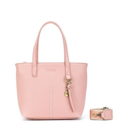 pink womens handbag with extra bags inside