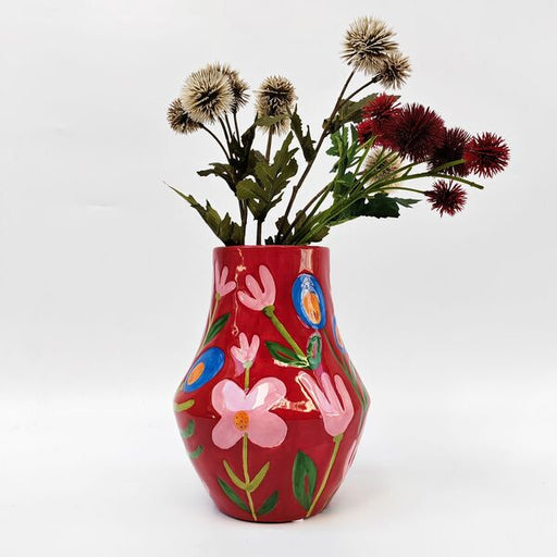 red floral brightly colored vase for flowers