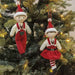 Two Christmas ornaments, a boy and a girl
