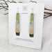 Pair of layered earrings on a Moe Moe branded card  background.
