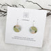 Pair of earrings on a Moe Moe branded card aura drop