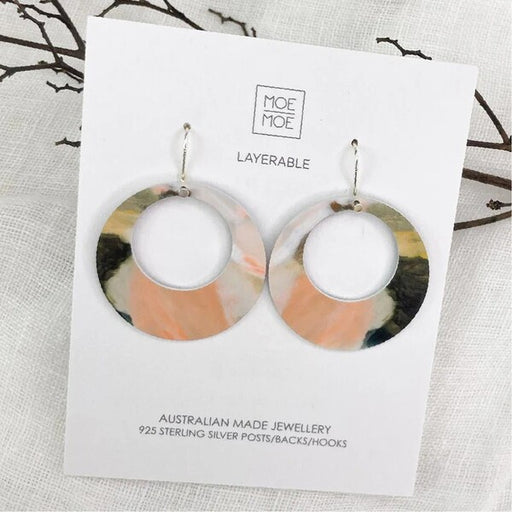 Pair of layered earrings on a Moe Moe branded card 
