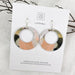 Pair of layered earrings on a Moe Moe branded card 