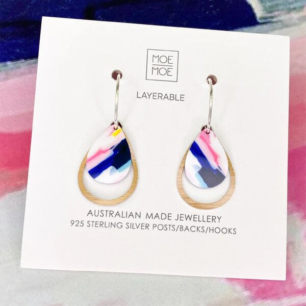 Teardrop-shaped earrings on a Moe Moe branded card with colorful design.