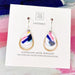 Teardrop-shaped earrings on a Moe Moe branded card with colorful design.