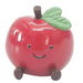Red apple-shaped object with a face, wheels, and a leaf 