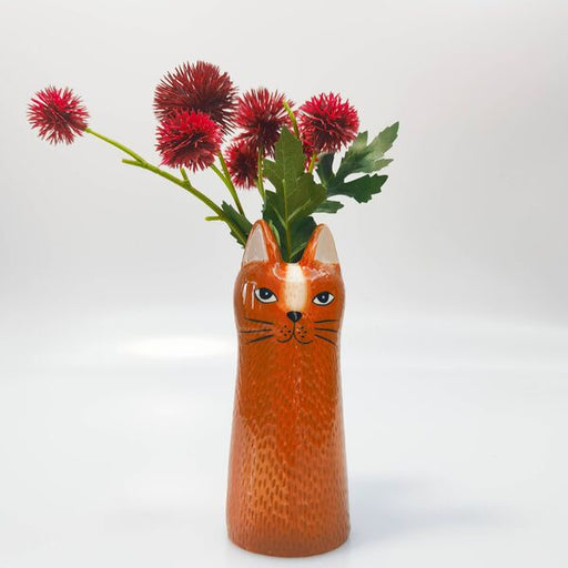 cat-shaped vase with flowers 