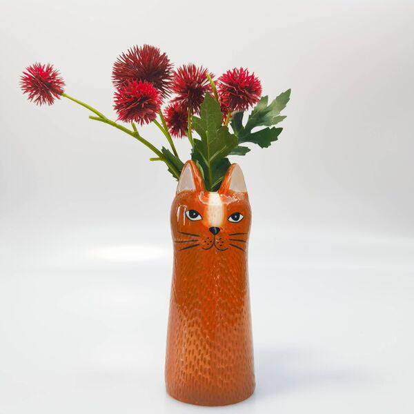 cat-shaped vase with flowers 