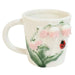 Ceramic mug with a ladybug and floral design 