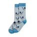 Pair of socks with bird pattern on a light blue background