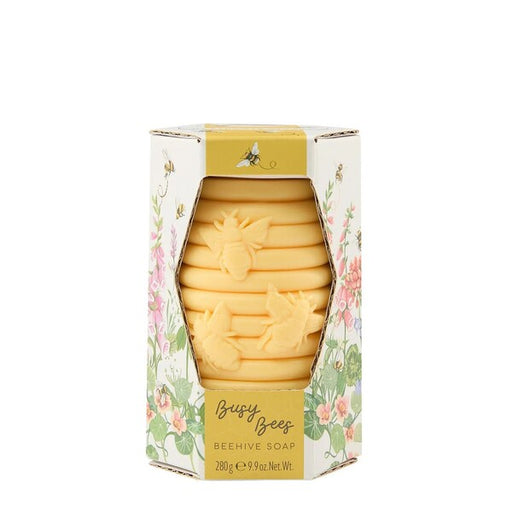 Beehive-shaped soap in a decorative box with floral design