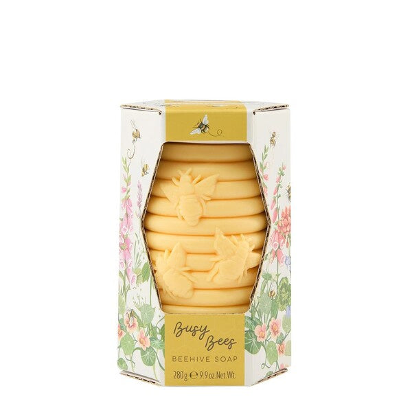 Beehive-shaped soap in a decorative box with floral design