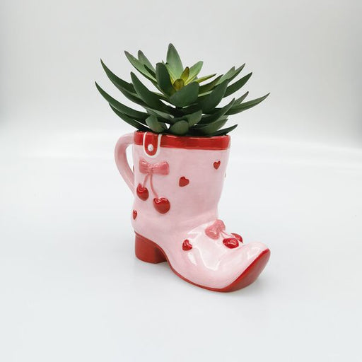 Pink boot-shaped mug planter