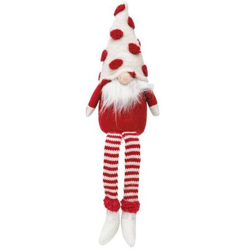 Decorative gnome with red and white striped legs and a white hat with red pom-poms  
