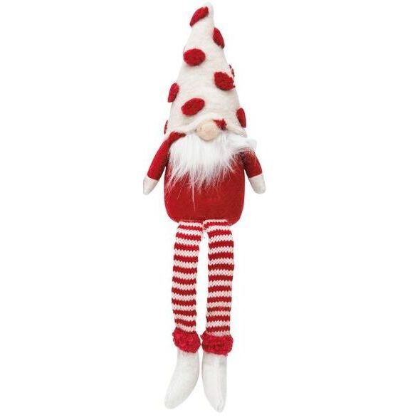 Decorative gnome with red and white striped legs and a white hat with red pom-poms  