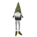 tomte figurine with green hat, striped pants, and white beard christmas decoration