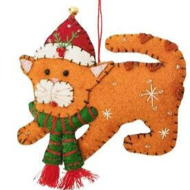 Decorative cat ornament wearing a Santa hat and scarf 