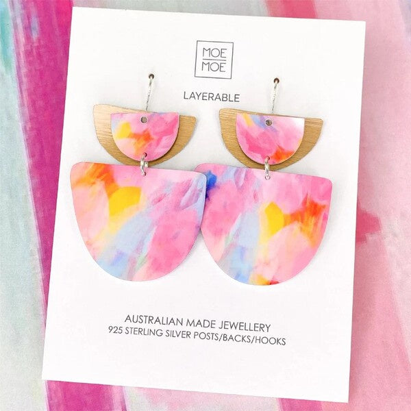 Colorful layered earrings on a Moe Moe branded card with pink and multicolor design.