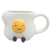 White mug with a yellow smiley face design 