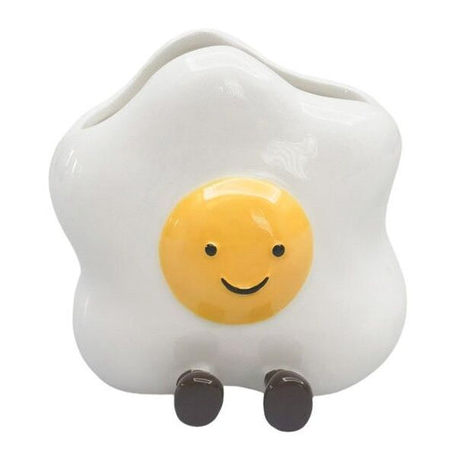 Fried egg-shaped container with a smiling face 