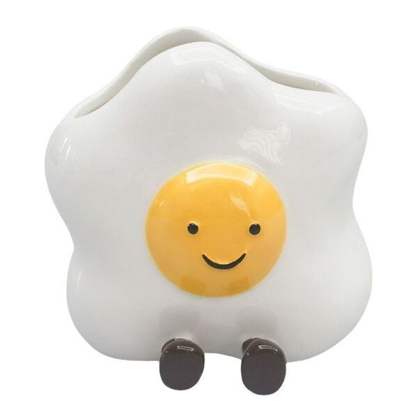 Fried egg-shaped container with a smiling face 
