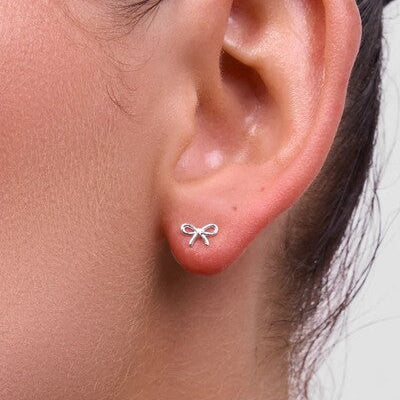 silver bow earrings liberte