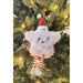 star-shaped Christmas ornament with a red hat and striped legs 