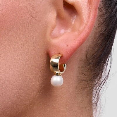 Gold earring with a pearl drop 