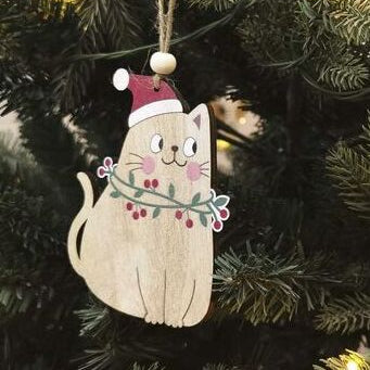 Wooden cat ornament with a Santa hat hanging