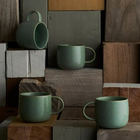 set of four green mugs for coffee