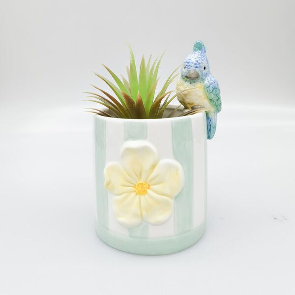 Decorative planter with a small bird figurine 