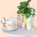 Decorative items including a pitcher, saucer, and bird figurines 