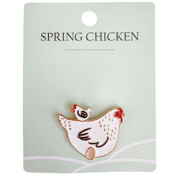 Chicken-shaped brooch on a 'Spring Chicken' card 