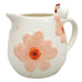 Ceramic pitcher with floral design and chicken figure
