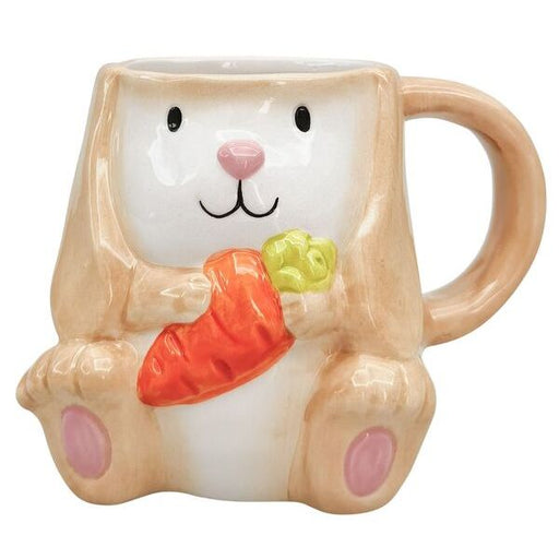 Ceramic mug shaped like a rabbit holding carrots   