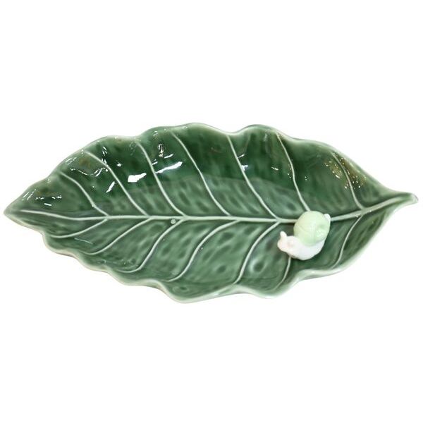 Green ceramic leaf-shaped plate with a small white snail