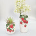 Two ceramic vases with strawberry design 