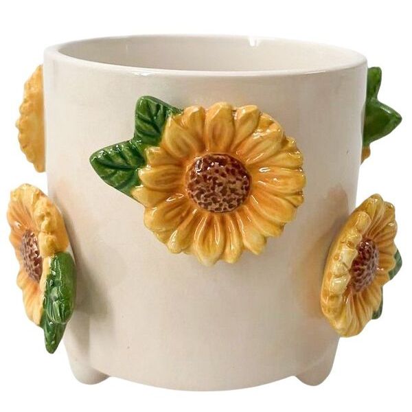 Ceramic pot with sunflower designs on a white background