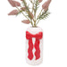 Decorative vase with a red bow 