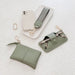 Set of green leather accessories including a pouch, key case