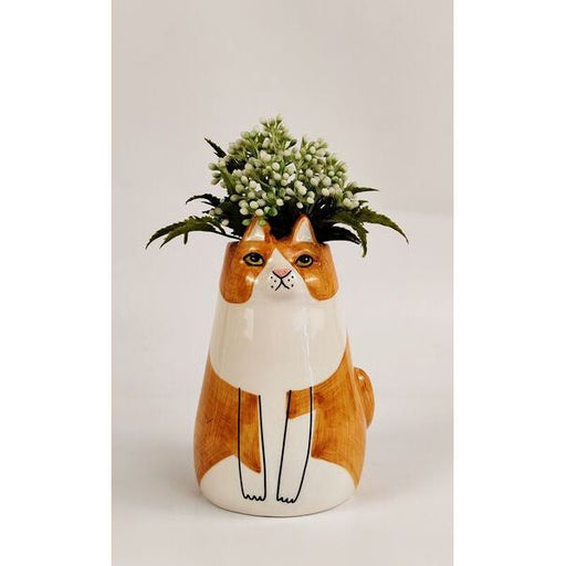 orange cat sitting vase for flowers