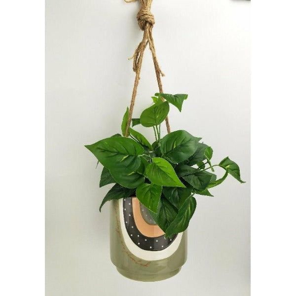 green and grey hanging planter with quote